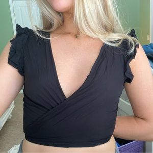 black ruffle tie front top
